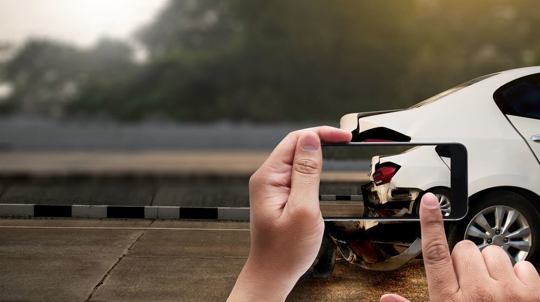 Taking a photo of a car accident